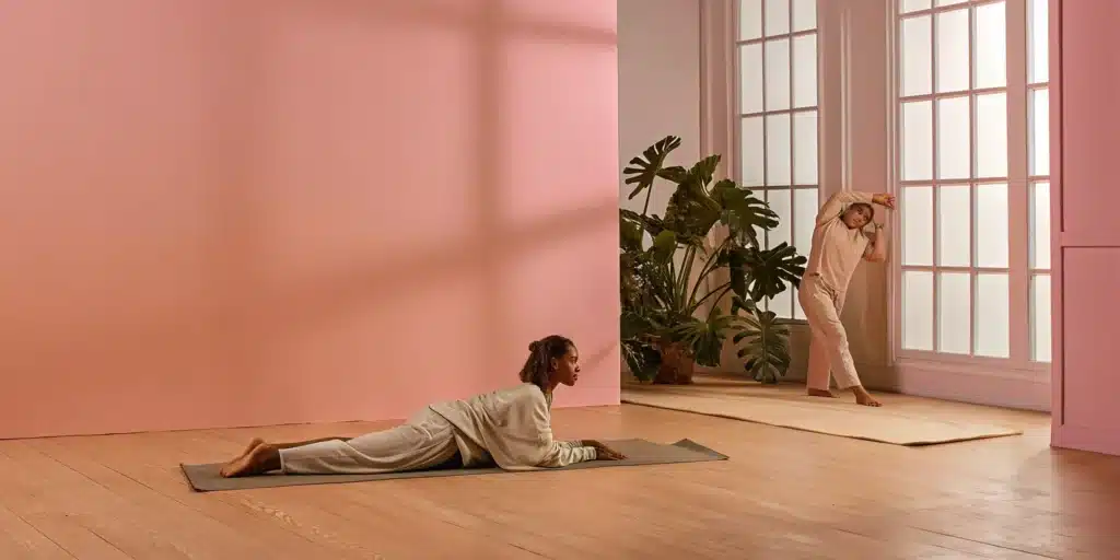 Two women performing one of the best stretches for hip mobility.