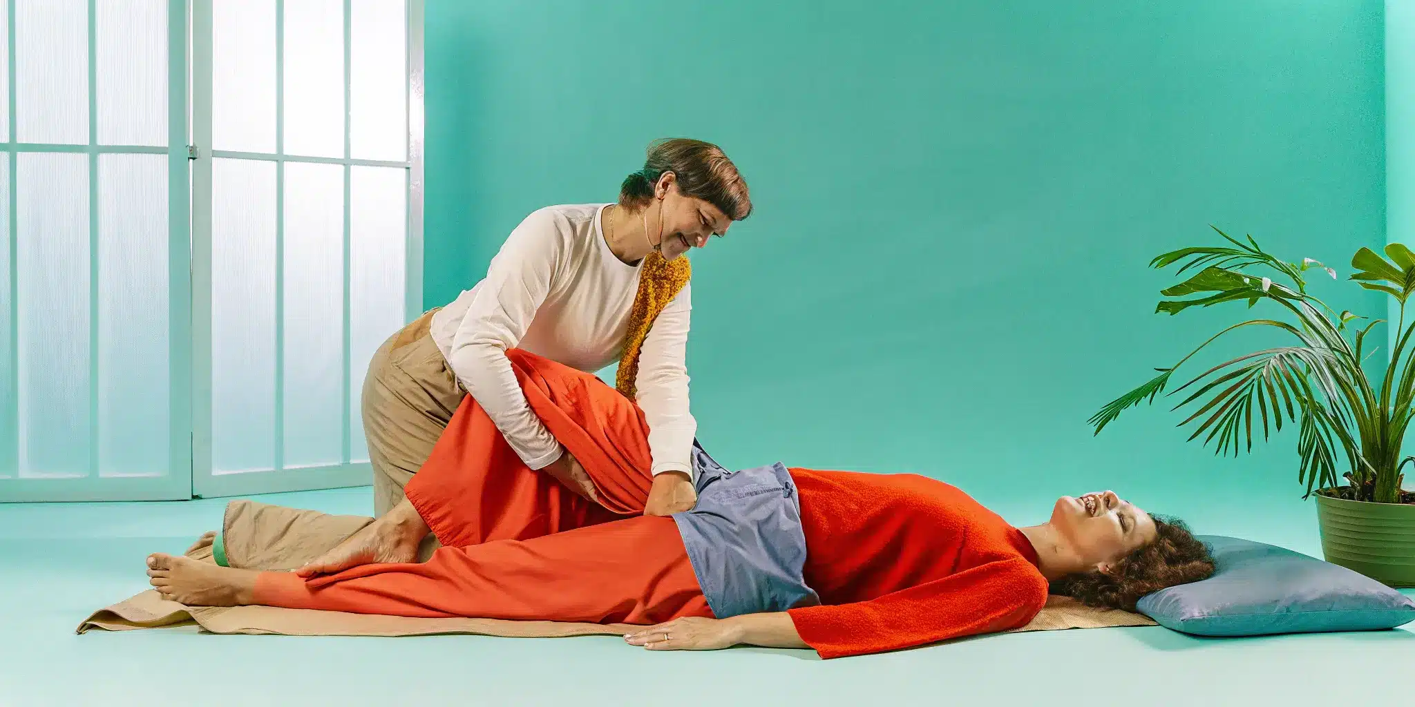 A person receives a partner-assisted PNF stretch, a technique for improving flexibility and mobility.