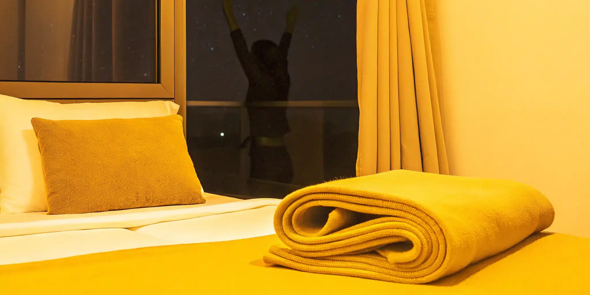 A person doing a relaxing stretch to get the benefits of stretching before bed.