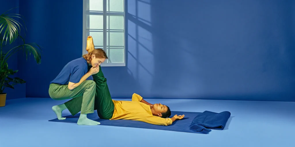 A person getting an assisted stretch for a body that feels stiff and heavy.