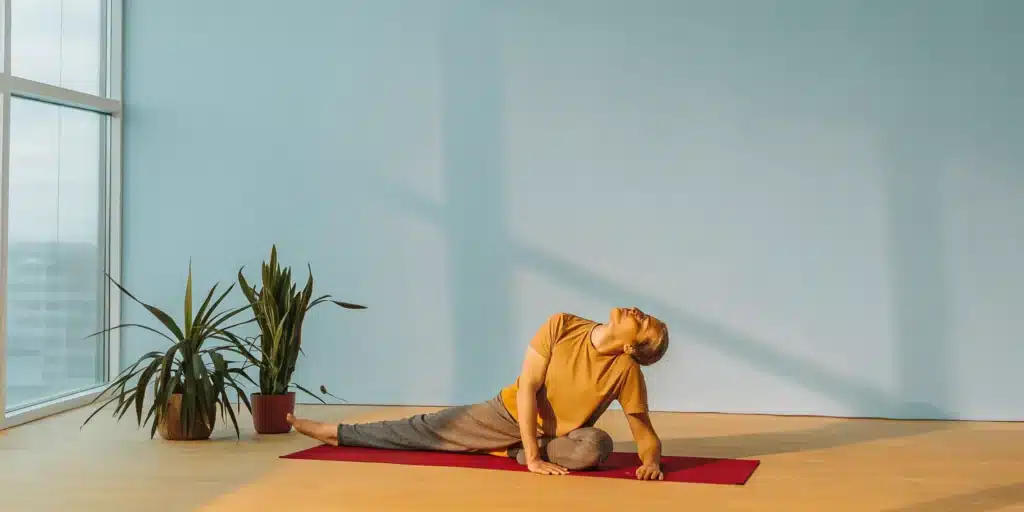Woman performing a seated side stretch to increase flexibility.