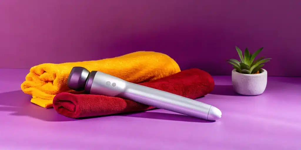 A percussion massager with various attachment heads for deep tissue muscle relief.