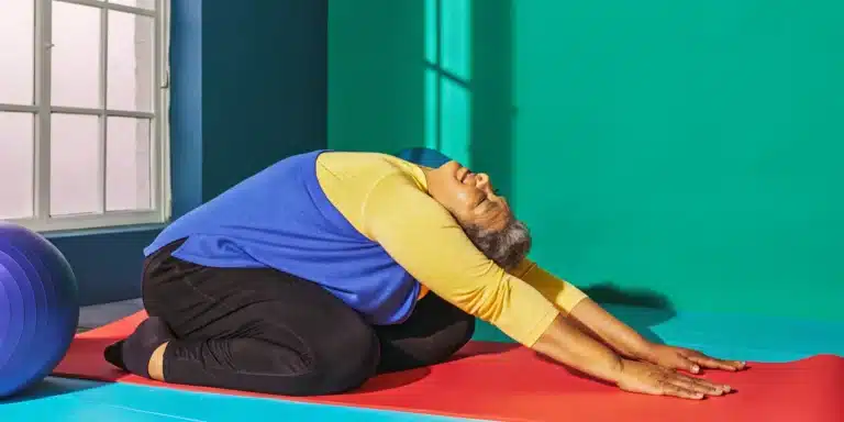 An older adult doing mobility exercises for over 50 to improve balance and reduce stiffness.